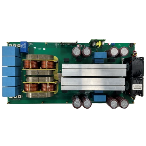 Power electronics board with large capacitors, coil inductors, and cooling heatsinks for an inverter or power supply.